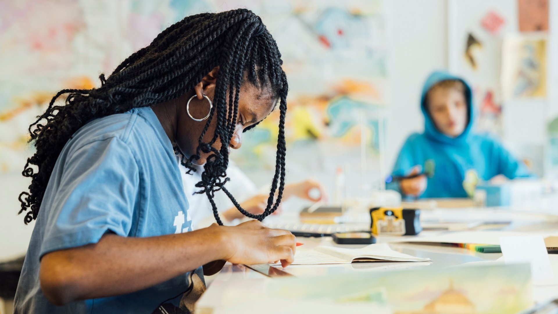 Two students working in design studio.